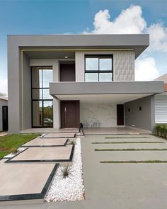 a modern house is shown in the daytime