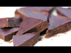 some pieces of chocolate on a white plate