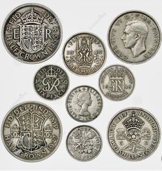 six different british silver sovereigns on white background