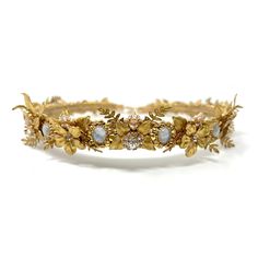 This delicate gold tiara features delicate metal flowers and vine woven within gold filigree around luminescent rainbow moonstones and sparkling diamond rhinestones. It's like wearing the sunset and moonbeams at the same time! Gold Tiara, Sparkling Diamond, Gold Filigree, Metal Flowers, The Sunset, Moon Stone, Sparkle Diamonds, Rainbow Moonstone, Tiara