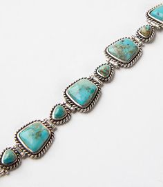 Handcrafted by artisans, this stunning bracelet is made of turquoise stones encased in sterling-silver twist wire rope. Elegant Sterling Silver Bracelet With Turquoise, Southwest Jewelry, Navajo Jewelry, Jewellery Making Materials, Handcrafted Bracelets, Twisted Wire, Turquoise Stones, Stone Bracelet, Turquoise Jewelry