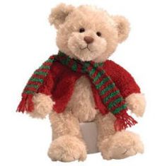 a white teddy bear wearing a red scarf and green striped scarf on its neck, sitting in front of a white background