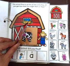 an open book with pictures of farm animals and barnyards on the pages in it