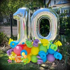 an inflatable number 10 surrounded by balloons