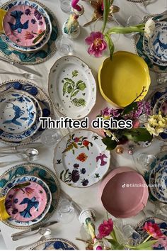 several plates and bowls are arranged on a table with the words'thrifted dishes'above them