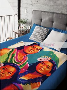 a bed with two pictures on it and pillows in front of the bedspread