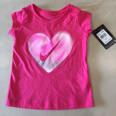 Nwt! Nike T-Shirt. Dark Hyper Pink With Heart Graphic In White, Gray And Pink. Short Sleeves. 100% Cotton. Very Comfortable. Bundle And Save! Size 2t Toddler Girl Shorts, T Shirt Picture, Girls Shirt, Nikes Girl, Nike Tshirt, Baby & Toddler Clothing, Nike Shirts, Boys Shirts, Print Logo