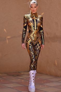 Micca Mirror Festival Jumpsuit gold Introducing the Ultimate Rhinestone Mirror Sequin Jumpsuit: Your Showstopper for Rave Parties, Festivals, Performances and Halloween Parties. Are you ready to shine and dazzle at your next big event? Look no further than our Rhinestone Mirror Sequin Jumpsuit – the perfect attire for women who love to steal the spotlight. Crafted with passion and precision, this one-of-a-kind party costume is designed to make you the center of attention wherever you go. Our jum Rhinestone Catsuit, Festival Jumpsuit, Mirror Costume, Mirrored Costume, Rhinestone Mirror, Catsuit Costume, Metallic Jumpsuits, Rave Party, Sequin Jumpsuit