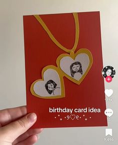 a hand holding up a card with two hearts on it that says, birthday card idea