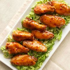 chicken wings with lettuce on a white plate