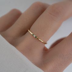 Minimalist style emerald ring is great for a dainty look and great for pairing with other rings!  - - - D E T A I L S - - - * Made of 925 Sterling Silver * Available in 14k Gold or Rhodium Plated * We use a THICK, DURABLE plating - for a piece that will last you years to come! * VERY HIGH QUALITY * Available in sizes 4-10 * Ring Width: 1.4mm * Features 3 small Cubic Zirconia Stones - made of the highest grade for an authentic diamond & emerald look! * Also available in Sapphire, Ruby and Diamond colored stones Diamond https://www.etsy.com/listing/654125758/dainty-ring-gold-minimalist-ring?click_key=d3db711020a80a7b87c274e916d1b52c5c1a78cb%3A654125758&click_sum=69d6f74b&ref=shop_home_active_7&pro=1&sts=1 Ruby https://www.etsy.com/listing/1382697466/ruby-ring-minimalist-ring-birthstone?click Small Emerald Ring, Simple Emerald Ring, 3 Stone Diamond Ring, Smaragd Ring, Gold Mangalsutra, Mangalsutra Designs, Zierlicher Ring, 3 Stone Rings, Ringe Gold