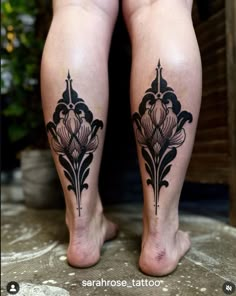 the legs and ankles of a woman with black tattoos on her feet, both showing their intricate designs