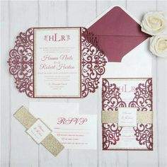 wedding stationery with gold glitter accents and burgundy paper