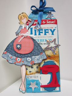 a paper doll is standing next to a card