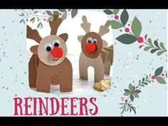 two paper reindeers with red noses and gold bells in front of a christmas card