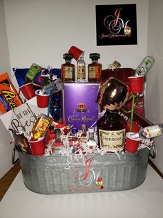 a basket filled with lots of liquor and condiments