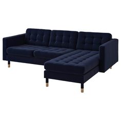 a large blue couch sitting on top of a white floor