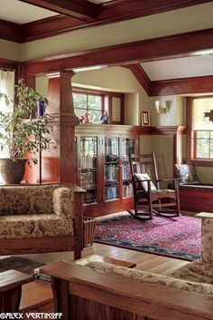 a living room filled with furniture and a book shelf