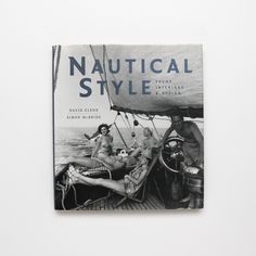 a book with an image of two people on a boat in the water and one person sitting