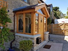 Oak porches with slated roofs protect your front door from driving rain and add a stylish dimension to your entrance. Choose either a porch canopy or a fully enclosed porch with a stone base. Front Door Bump Out Entrance, Corner Porch Ideas Entrance, Front Door Extension Entrance, Enclosed Front Porch Ideas Uk, Bump Out Front Door, Front Door Addition Entrance, Enclosed Front Door Entrance, Enclosed Portico Entry, Uk Porch Ideas