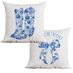 two blue and white pillows with cowboy boots on them