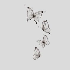 three butterflies flying in the air