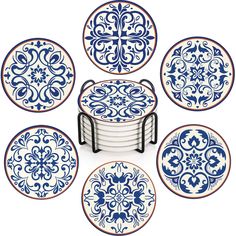 six blue and white plates with designs on them