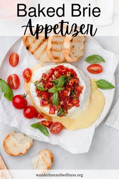 baked brie appetizer on a plate with bread and tomatoes