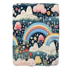 a blanket with an image of clouds and rainbows