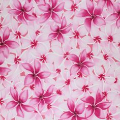 a pink and white background with flowers on it