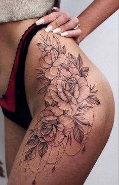 a woman's thigh with flowers on it