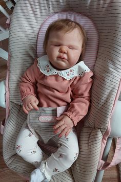 a baby is sitting in a high chair