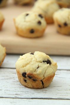 chocolate chip muffins sitting on a cutting board