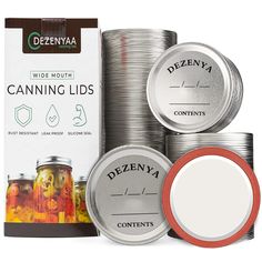 canned canning lids are stacked on top of each other in front of a package of contents