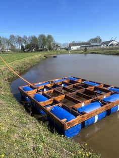 a blue raft tied to the side of a body of water