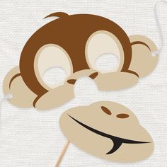 a monkey mask is shown on top of a stick