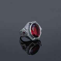 Bold and masculine lines were used in the design with carvings and geometric shapes. Inspired by the Art Deco movement, characterized by baroque ornamentss and angular shapes. Handmade Ring Details Metal: 925 Sterling SILVER  Gemstone Type: Red RUBY Stone Average Weight: 22 grams Birthstone: July  Astrology Zodiac Sign: Cancer Design: inspired by medieval jewelry, occult men's rings, protection rings, goth bands, Victorian jewellery. Occasion: Party, Engagement, Wedding, Eternity Anniversary ban Red Goth, Goth Bands, Medieval Rings, Ruby Anniversary, Baroque Ornament, Medieval Jewelry, Victorian Rings, Ruby Stone, Handmade Rings