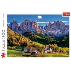 a jigsaw puzzle is shown with mountains in the background and houses on the hillside