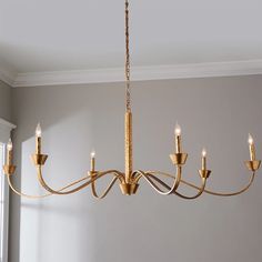 a gold chandelier hanging from the ceiling