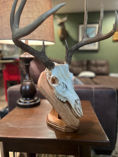 a deer's head is on top of a table