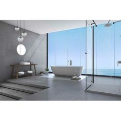 a modern bathroom with an ocean view is pictured in this image, it appears to be very large