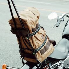 a motorcycle with a bag strapped to the back