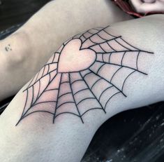 a person with a spider web tattoo on their arm