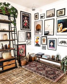 a living room filled with lots of pictures on the wall