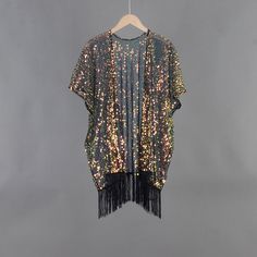 Welcome to my shop, I am in China. It will need around 30 days for international orders. Please consider the time when placing order. Sequin bohemian kimono,perfect for a casual day out. Material: mesh, sequins Body width available S: 27.5 inches(70cm), circle 55 inches(150cm) M: 31.5 inches(80cm), circle 63 inches(160cm) L: 35.5 inches(90cm), circle 71 inches(180cm) Body length available Short:33.5 inches (85cm) include tassels Long: 43.3 inches (110cm) include tassels CARE: Wash gently by hand in cold water.  Single wash. Don't press! Hang to dry.  Maybe you will like other items in my shop, find them here: https://www.etsy.com/shop/twogirlstudio Black Summer Party Kimono, Bohemian Open Front Kimono For Party, Spring Party Kimono With Open Front, Spring Party Open Front Kimono, Long Black Party Kimono, Bohemian Kimono For Summer Party, Bohemian Summer Party Kimono, Black Long Kimono For Party, Summer Party Bohemian Kimono