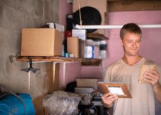 a man holding a box in his hands