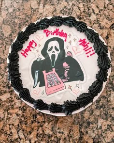 a birthday cake with a grime themed frosting on it