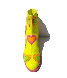 These adorable ankle boots are crafted in a neon yellow leatherette and feature rainbow patent leatherette hearts throughout. Complete with side zipper and 2 inch heels.Please note these shoes have a 2-3 day handling time before they will ship from our warehouse and there is a 10% restocking fee if you choose to return. Funky Shoes Macy's, Power Puff Boots, La Moda Boots Hearts, Vivid Color Shoes, I Love Lucy Shoes, Dopamine Dressing Shoes, Comedian Headshots, Hoedown Outfit, Toola Roola