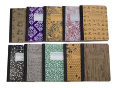 six notebooks lined up in different colors and patterns, each with a note pad