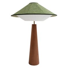 a lamp with a wooden base and green shade on the top, sitting in front of a white background